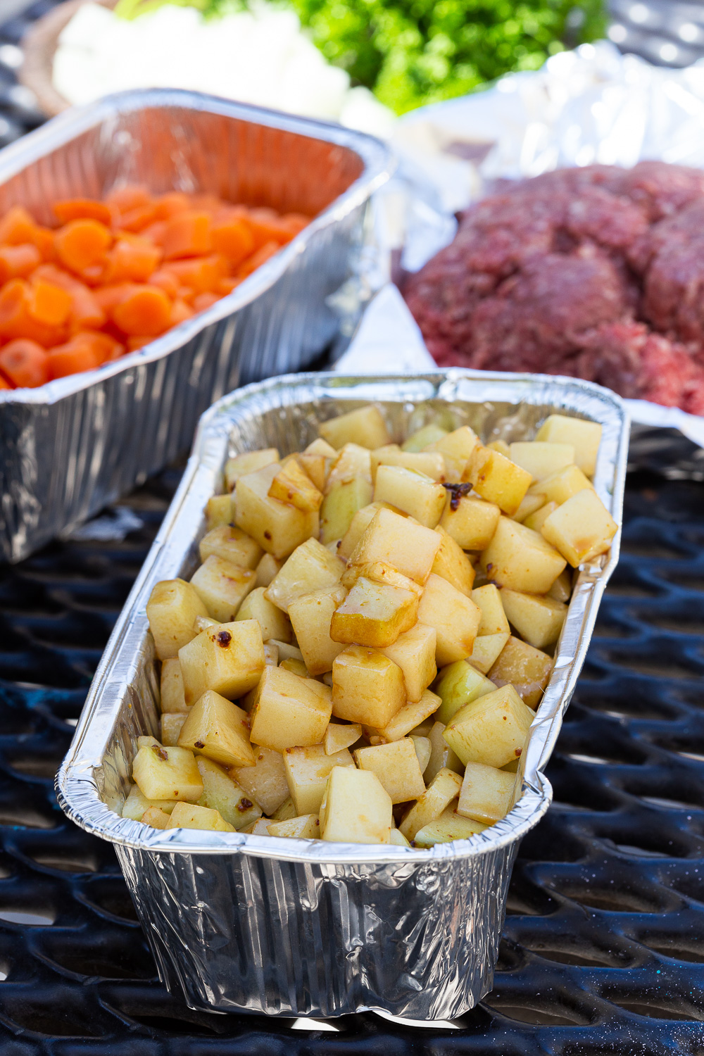 Foil dinners, cubed potatoes seasoned with oil and beef base for a delicious campfire dinner. 