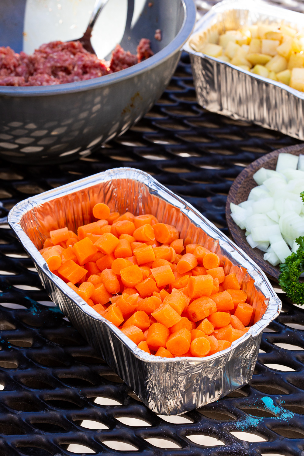 Carrots lightly seasoned and ready for campfire foil dinner packets