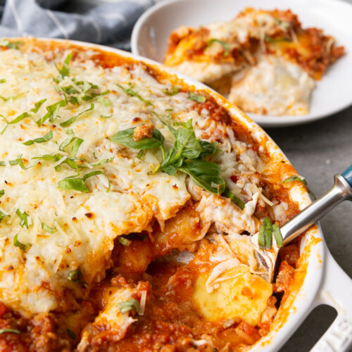 Ravioli lasagna, a lazy lasagna made up of layers of cheese raviolo, meat sauce, ricotta, and mozzarella cheese.