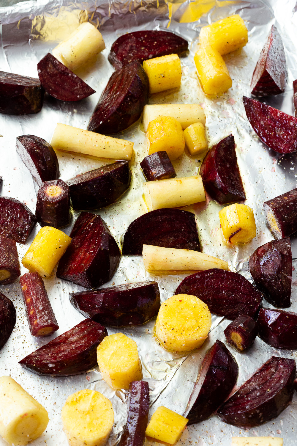 Roasted beets and carrots on a roasting pan. 