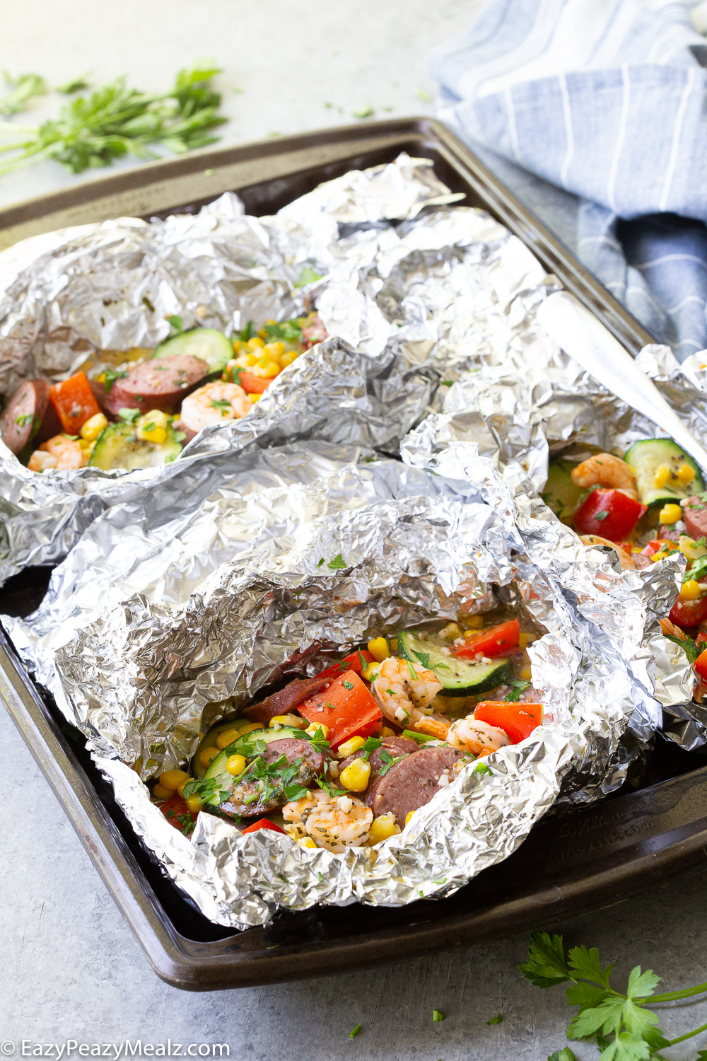 Shrimp and Kielbasa foil packs baked in the oven. 