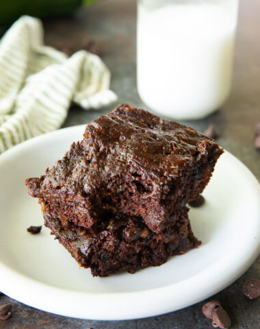 Zucchini brownies on a plate with a bite taken out