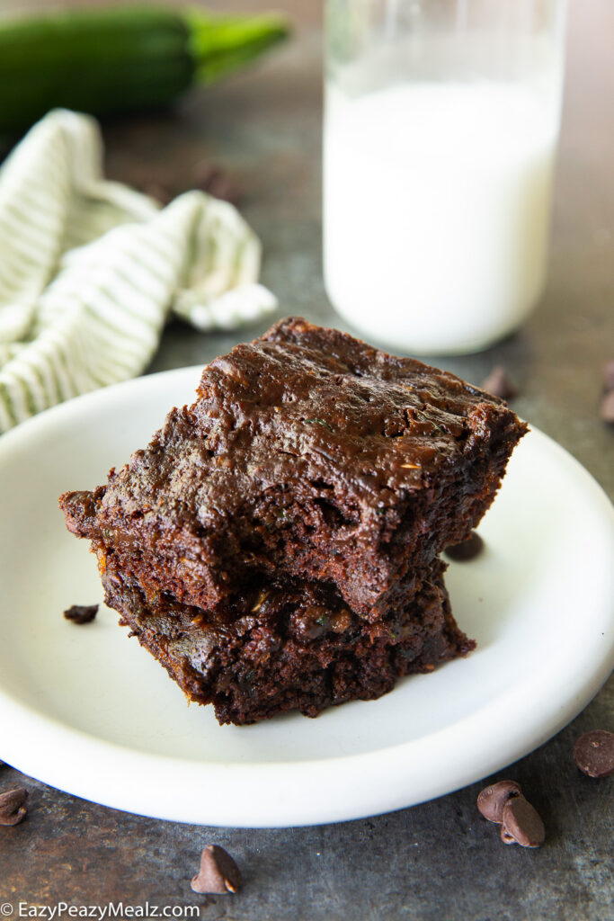 Zucchini brownies on a plate with a bite taken out